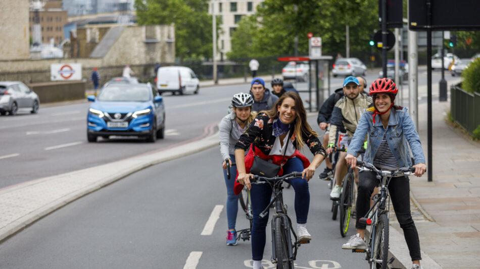 People waiting at cycle traffic light