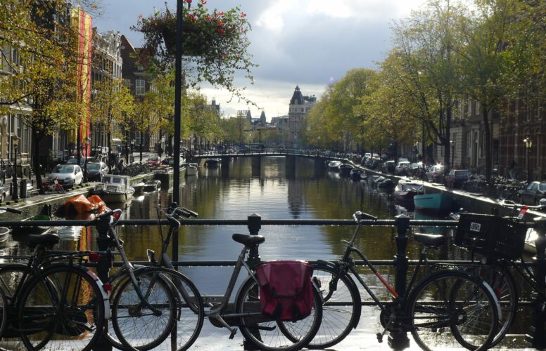 Bikes parked by Amsterdam canal