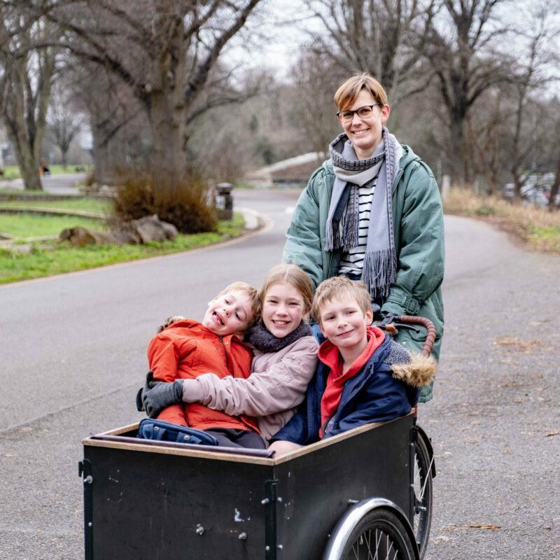 Woman with children in cargo bike