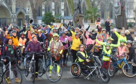 Woman with bike and friends at LCC protest in Westminster