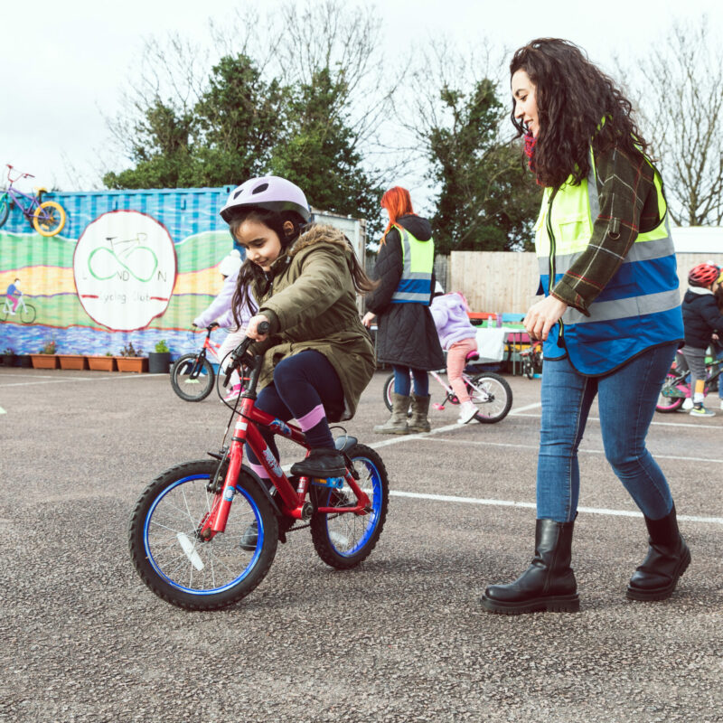LBK woman instructor and child cycling