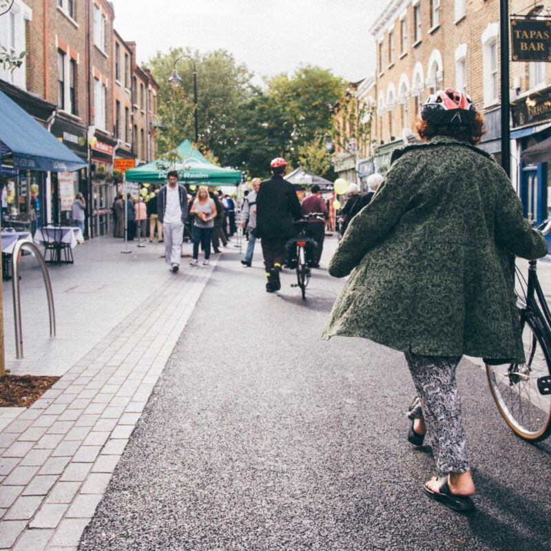 Low Traffic Neighbourhood in Waltham Forest with woman walking with a bike